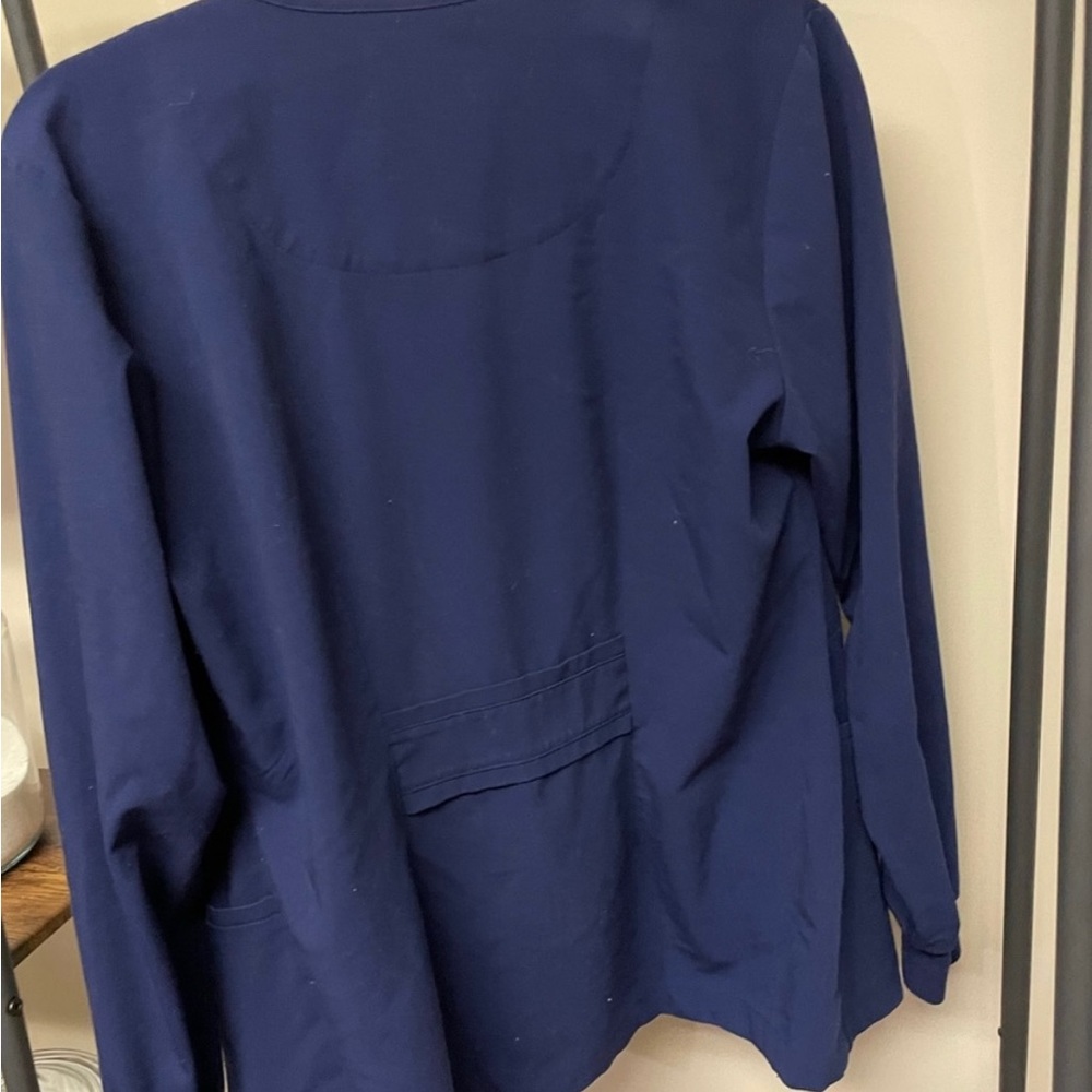 Grey’s Anatomy size medium scrub jacket.